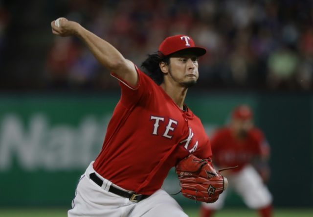 Yu Darvish of the Rangers throws against the Tampa Bay Rays in the second inning, at Globe
