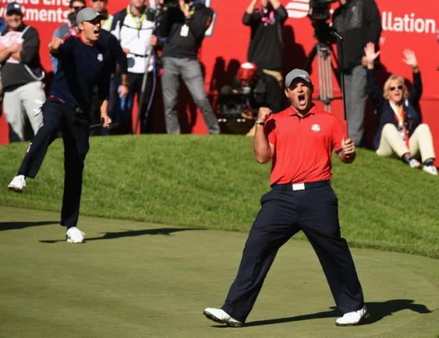 USA's Patrick Reed (R) and Jordan Spieth react after winning against Team Europe Justin Ro