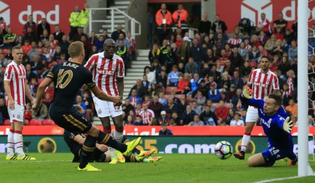 Tottenham's Harry Kane (2L) scores his team's fourth goal during their Premier League matc