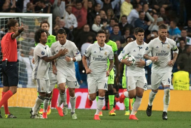 Real Madrid's Cristiano Ronaldo (2nd L) celebrates with teammates after scoring a goal dur