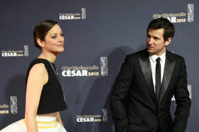 French actress Marion Cotillard (L) and her partner actor Guillaume Canet arrive at the 40