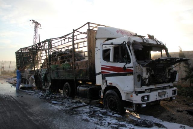 The UN said at 18 trucks in the 31-vehicle humanitarian aid convoy were destroyed en route