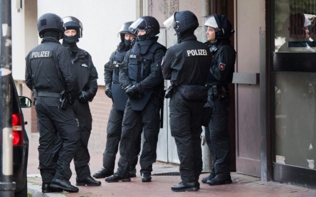 More than 200 police took part in pre-dawn raids in northern Germany to detain three men a