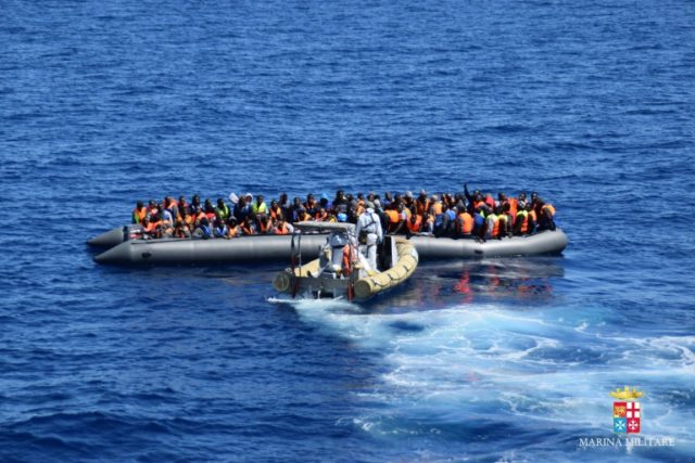Picture released by the Italian Navy (Marina Militare) shows a rescue operation of migrant