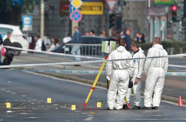 Hungarian police officials investigate in Budapest after an explosion of unknown origin in