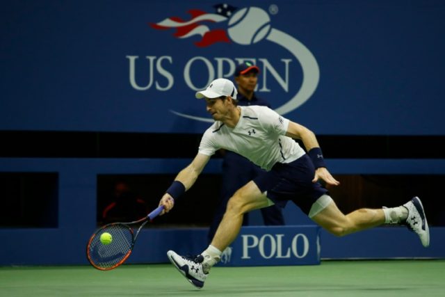 Andy Murray of Great Britain hits a return against Marcel Granollers of Spain during their