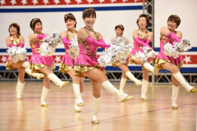 Members of the middle-aged and elderly women's cheerleading group 'Japan Pom Pom' perform