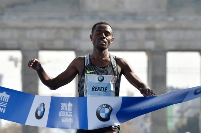 Ethiopian Kenenisa Bekele crosses the finish line past the Brandenburg Gate to win the 43r