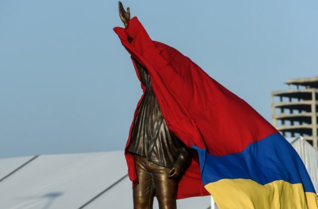 A statue of late Venezuelan president Hugo Chavez is unveiled during a demonstration by ru