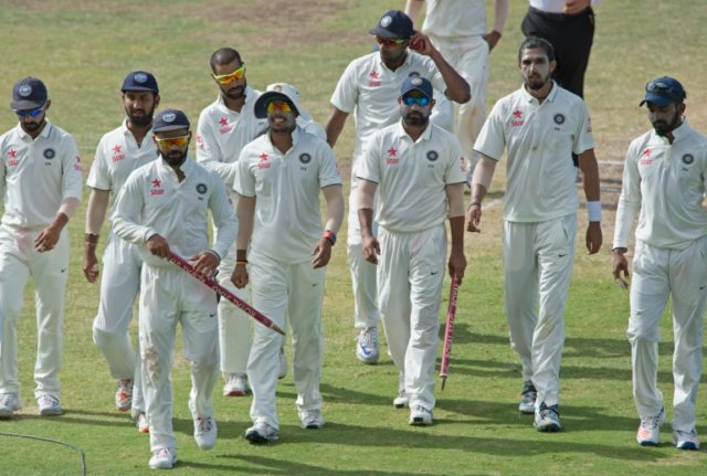 India's Virat Kohli leads the team off the field after a Test match in St John's, Antigua,