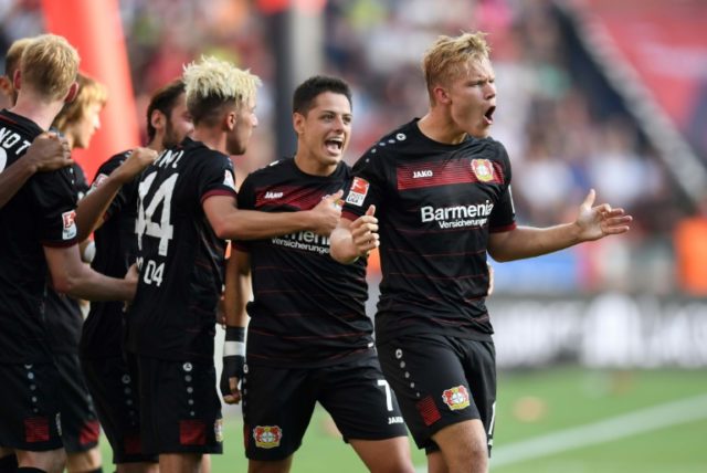Leverkusen's midfielder Joel Pohjanpalo and his teammates celebrate during German first di