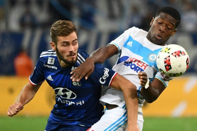 Olympique de Marseille's Belgian forward Aaron Leya Iseka (R) competes for the ball with L