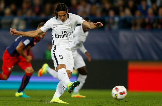 Paris Saint-Germain's Uruguayan forward Edinson Cavani shoots and scores a goal during th