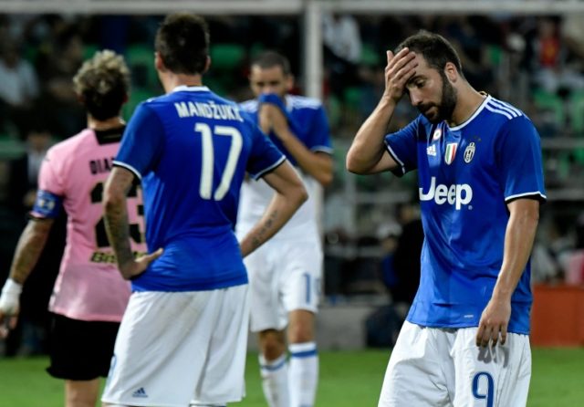 Juventus' forward Gonzalo Higuain reacts during an Italian Serie A football match against