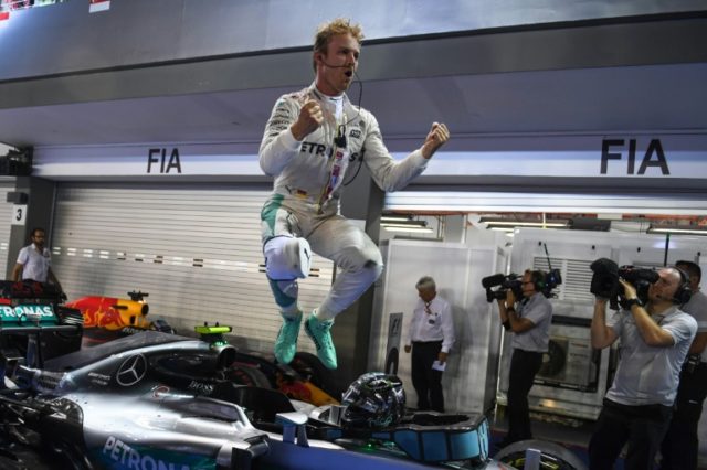 Mercedes driver Nico Rosberg celebrates winning the Formula One Singapore Grand Prix on Se