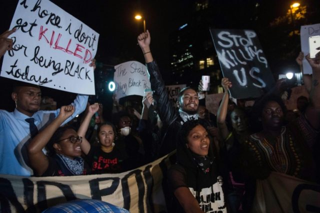 Protesters chant slogans during a march in Charlotte, North Carolina, on the third night o