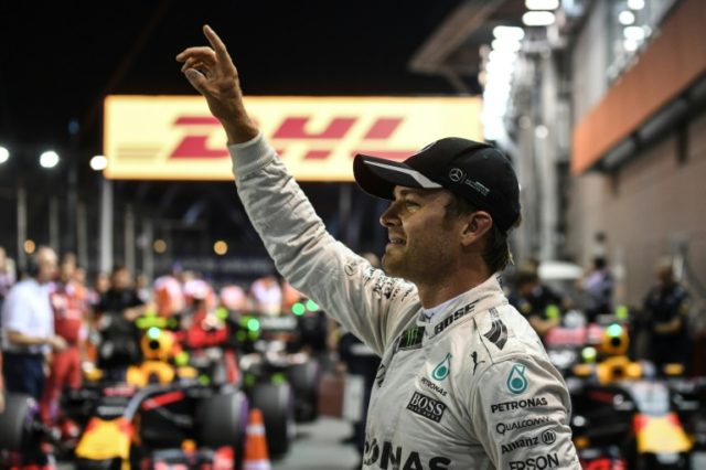 Mercedes driver Nico Rosberg of Germany celebrates his pole position after the qualifying