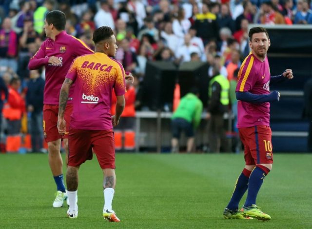 Barcelona's Luis Suarez (L), Neymar and Lionel Messi (R) warm up before the Spanish "Copa