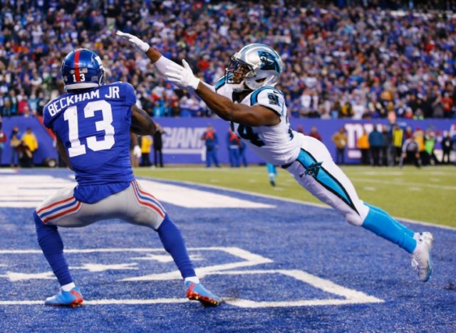Odell Beckham (L) of the New York Giants and Josh Norman of the Carolina Panthers (R) foug