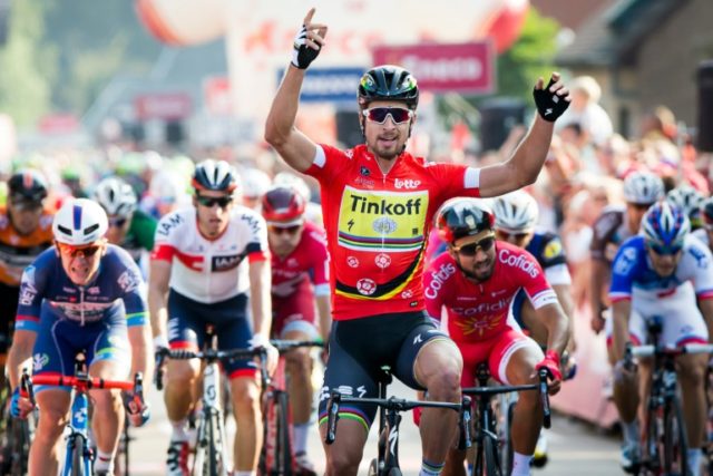 Tinkoff's Slovakian cyclist Peter Sagan, wearing the red jersey, celebrates after winning