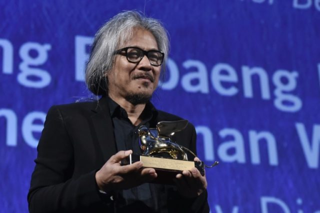Director Lav Diaz holds the Golden Lion award for Best Film for the movie "The Woman Who L