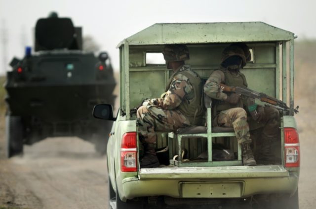Nigerian soldiers patrol on June 5, 2013 near Maiduguri