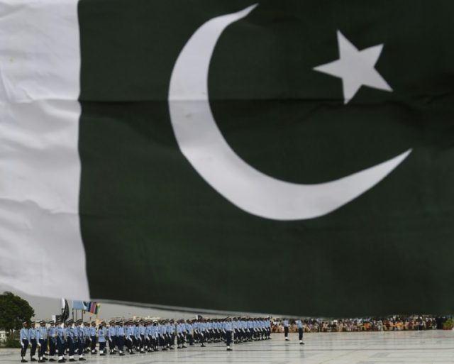 Pakistan Air Force cadets march past the mausoleum of the country's founder Mohammad Ali J