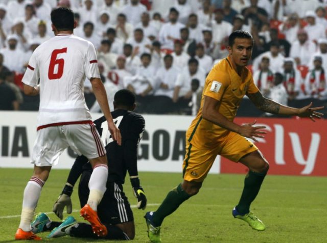 Australia's Tim Cahill (R) celebrates after scoring a goal against the United Arab Emirate