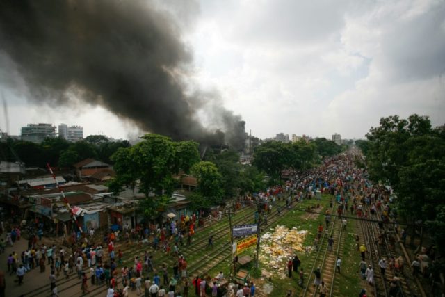 Smoke and flames billow from a burning garment factory in Tongi, the key Bangladeshi garme
