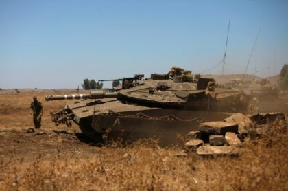 An Israeli tank stationed in the Golan Heights near the Quneitra crossing with Syria