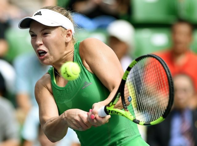 Caroline Wozniacki weathered an early storm from Japan's Naomi Osaka before running out a