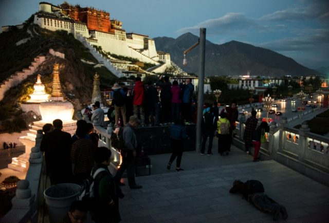 Tourists visit the iconic Potala Palace in Lhasa in China's Tibet Autonomous Region
