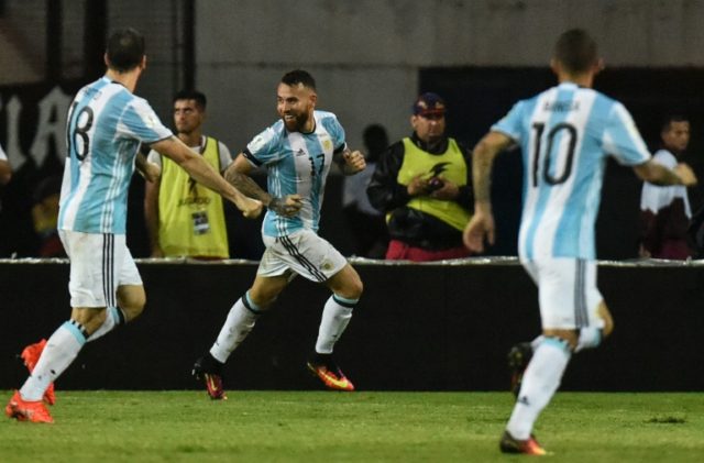 Argentina's Nicolas Otamendi (C) popped up in the 83rd minute to steer home a whipped in c