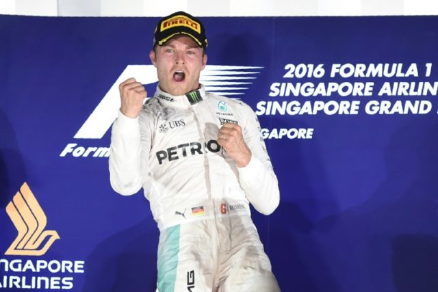 Mercedes driver Nico Rosberg celebrates after winning the Singapore Grand Prix on Septembe