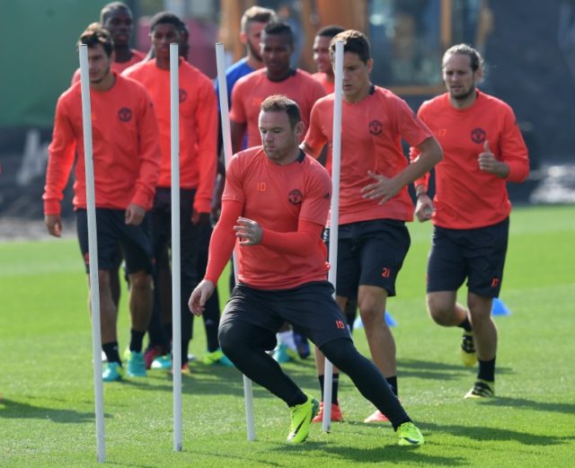 Manchester United's captain Wayne Rooney leads the team during a training session at their