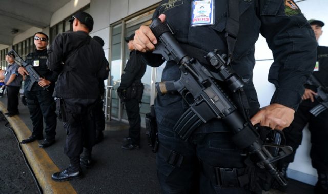 Philippine National Police stand guard at Manila International Airport in 2011