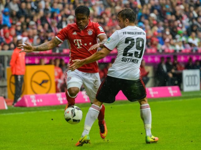 Bayern Munich's Douglas Costa (left) in action against Ingolstadt during a Bundesliga matc