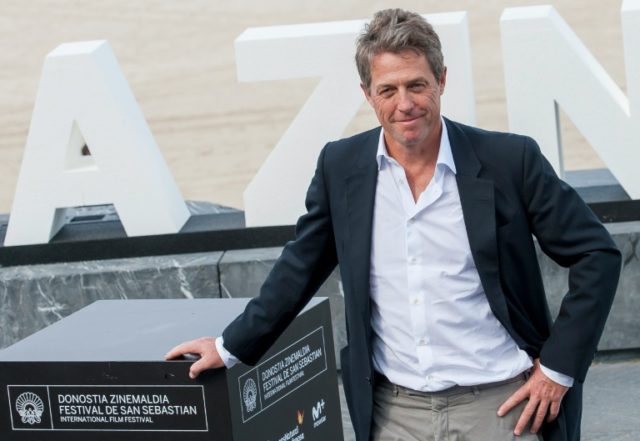 British actor Hugh Grant poses for a photocall after the screening of his film "Florence F