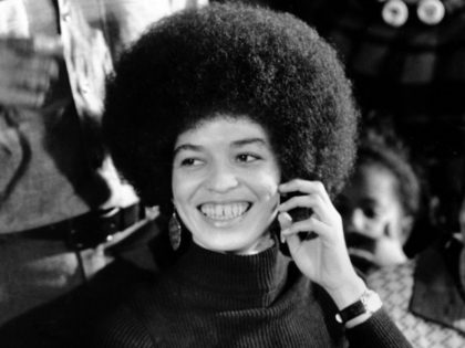 Angela Davis, black Communist jailed for more than a year on murder-conspiracy charges resulting from San Rafael courthouse slaying of a judge and three others, smiles as she talks during an exclusive interview with Associated Press reporters Edith Lederer and Jeannine Yoemans in tiny green interview room at Santa Clara …
