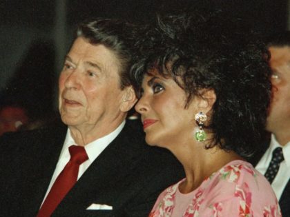 President Reagan sits with actress Elizabeth Taylor during her American Foundation for AIDS Research dinner in Washington on May 31, 1987.