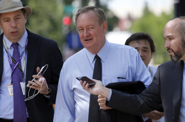 Sen. Michael Crapo, R-Idaho is pursued by reporters as he arrives for a meeting with Repub