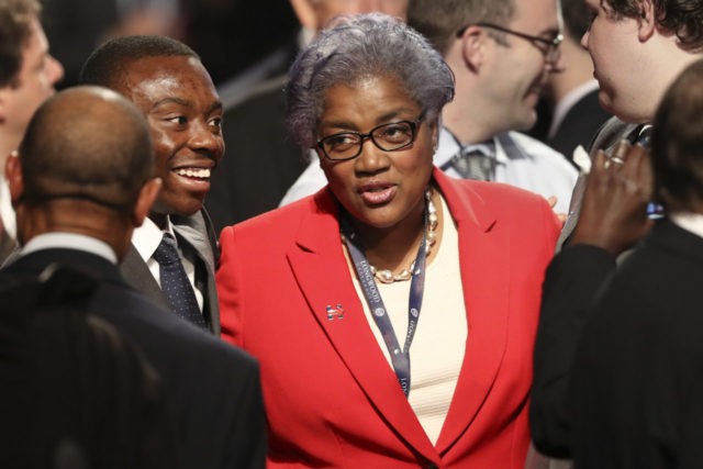 Democratic party chairperson Donna Brazile talks with audience members before the debate b