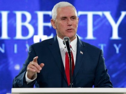 Republican vice-presidential candidate, Indiana Gov. Mike Pence, gestures as he gives a speech at Liberty University in Lynchburg, Va., Wednesday, Oct. 12, 2016. (AP Photo/Steve Helber)