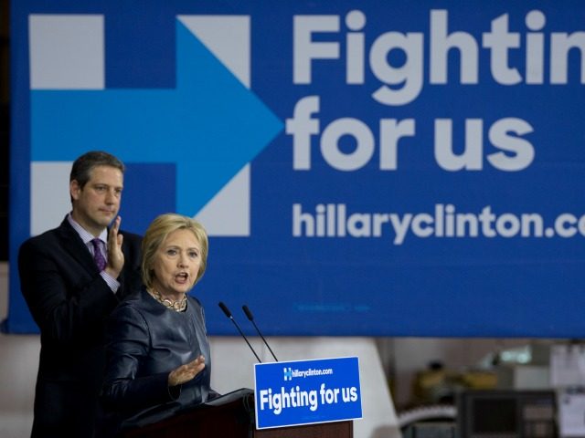 emocratic presidential candidate Hillary Clinton joined by Rep. Tim Ryan, D-Ohio., speaks during a campaign event at M-7 Technologies in Youngstown, Ohio, Saturday, March 12, 2016. (