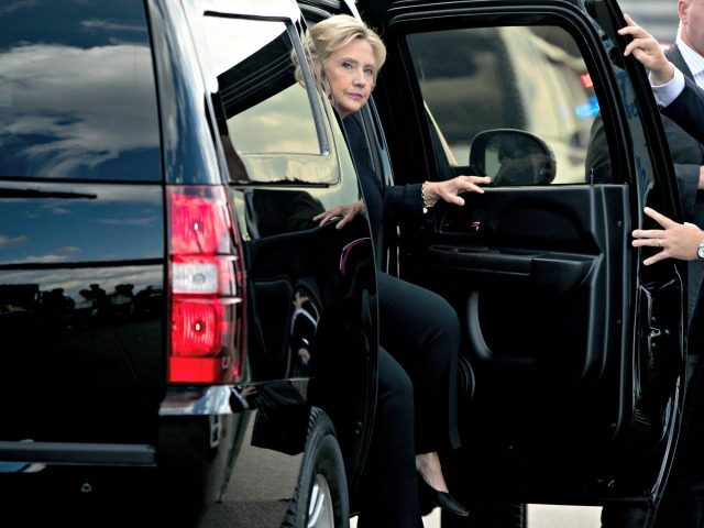 Clinton Peaks Out of Limo Andrew HarnickAP