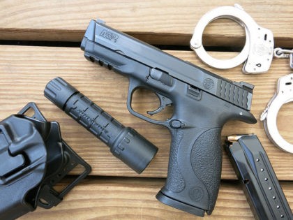 Firearm-mounted flashlight and police gear (James Case / Flickr / CC)
