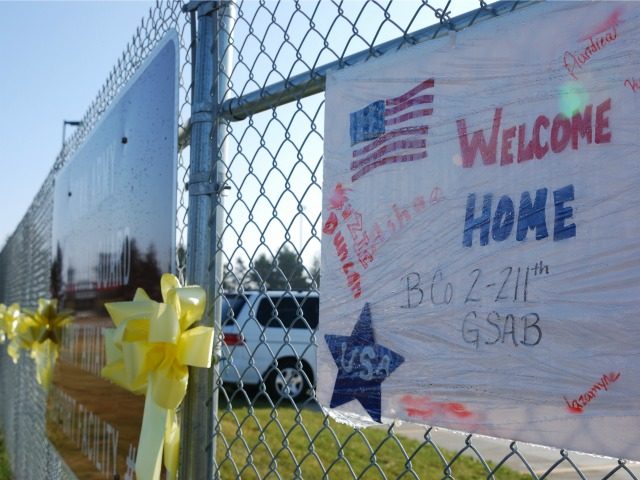 Yellow ribbons and a welcome home sign were tied to a fence outside an Iowa National Guard facility in Davenport, Iowa ahead of a homecoming ceremony for 75 veterans returning from Iraq after a year-long deployment on November 23, 2011.