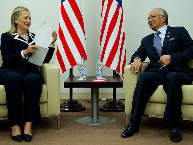 Malaysian Prime Minister Najib Razak (R) speaks with US Secretary of State Hillary Clinton (L) during a bilateral meeting for the Asian Pacific Economic Cooperation (APEC) Summit in Vladivostok on September 9, 2012. AFP PHOTO/POOL/Jim WATSON (Photo credit should read JIM WATSON/AFP/GettyImages)