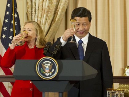 Chinese Vice President Xi Jinping (C) proposes a toast with Vice President Joe Biden (R) and Secretary of State Hillary Clinton (L) during a a lunch in honor of Chinese VP at the State Department in Washington, DC, February 14, 2012. AFP PHOTO/Jim WATSON (Photo credit should read JIM WATSON/AFP/Getty …