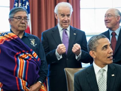 L-R: Samuel Gomez (L), War Chief of the Taos Pueblo, US Vice President Joseph R. Biden, US Secretary of the Interior Kenneth L. Salazar and Asha Lela, Chair of the Islanders for the San Juan Islands National Monument, look on as US President Barack Obama speaks about signing the First …